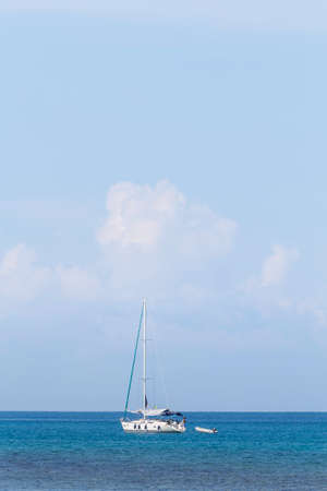 yacht and blue water tropical oceanの写真素材