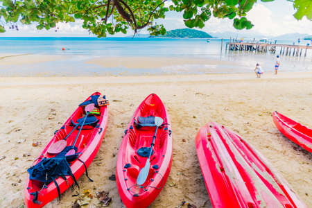Red kayaks on tropical beachの写真素材