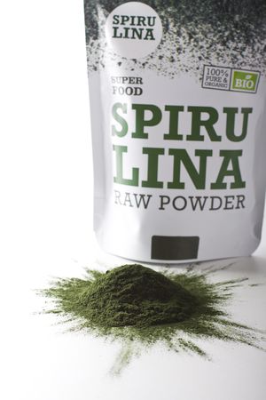 Spirulina raw powder on a white backgroundの写真素材