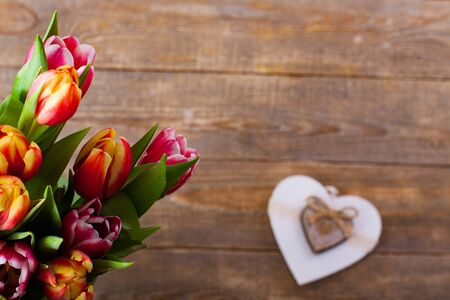 Bouquet of tulips flowers with heart for love.の写真素材