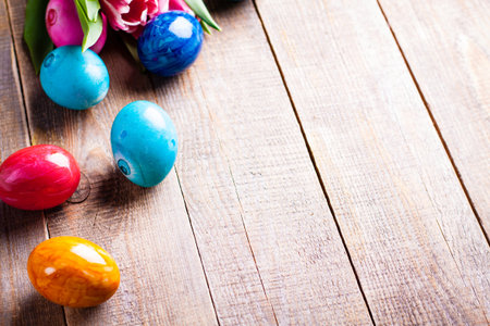 Easter egg on wooden background.