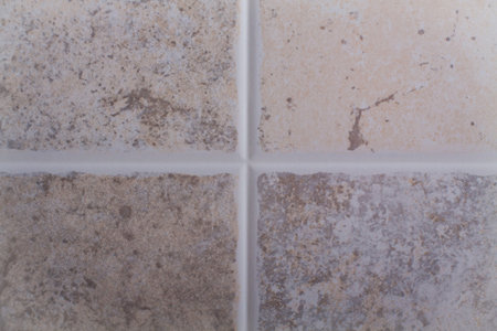 Fragment of ceramic tiles wal with cross.