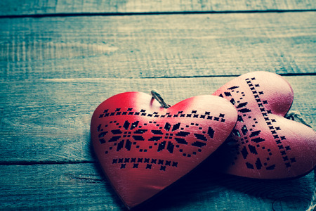 Heart on a wooden background. Vintage style.の写真素材