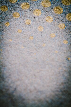 Cardboard background with gold dots and circles.の写真素材