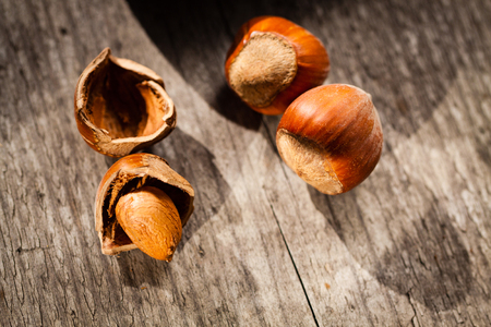Hazelnuts on a wooden background.の写真素材