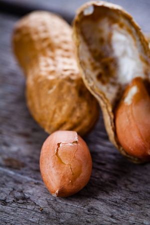 Peanuts on wooden background.の写真素材