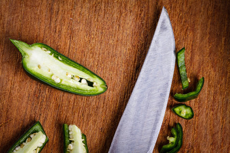 Green pepper on cutting board.