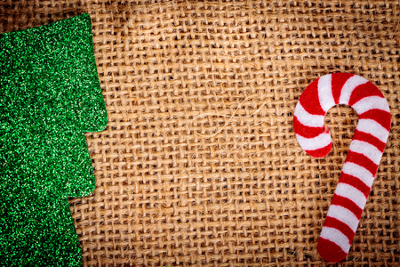 Felt christmas decorations on jute background with copy space.の写真素材