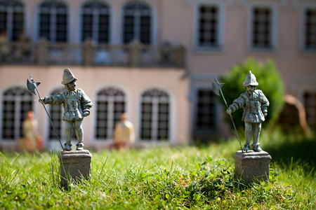 Statues of knights small figurine stand the castle courtyard.の写真素材