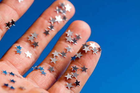 Small glowing stars on hand.