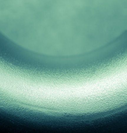 Sandblasted stainless steel background, empty space with beam of light for your project.の写真素材