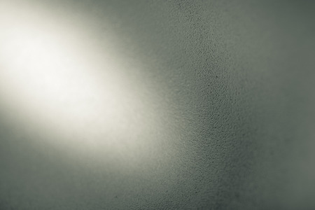 Sandblasted stainless steel background, empty space with beam of light for your project.の写真素材