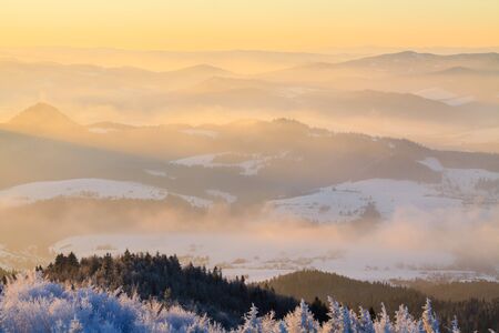 Mountain valley panorama during sunrise. Beautiful natural panoramic landscape in winter time.の写真素材