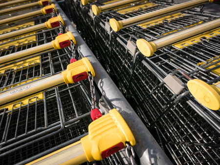 Shopping carts stay on parking, locking system on the coin.の写真素材