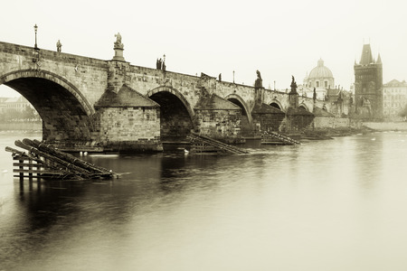 Misty morning in Prague near Charles bridge, old stylized photography.の写真素材