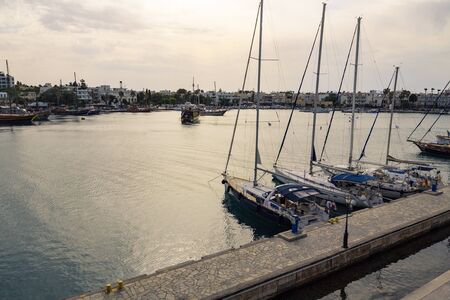 Yacht marina and ferries terminal of Kos town in greece islands of aegean sea. View from above on turquoise water surface of Kos port.の写真素材