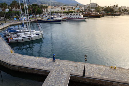 Yacht marina and ferries terminal of Kos town in greece islands of aegean sea. View from above on turquoise water surface of Kos port.の写真素材