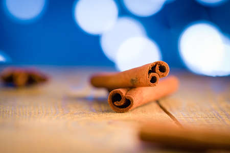 Cinnamon sticks in christmas light.の写真素材