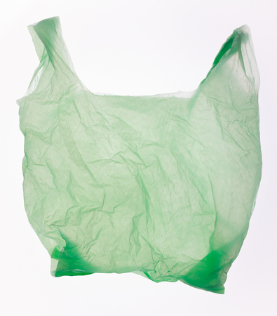 Green plastic bag isolated on white.の写真素材