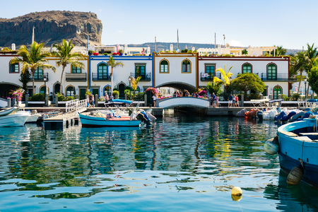 Colourful port with palm trees Puerto De Mogan on Gran Canaria island.の写真素材