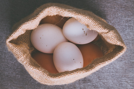 Rural eggs in jute bag.の写真素材