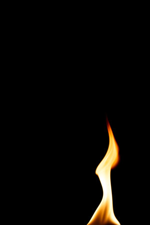 Single naked flame in black space.の写真素材