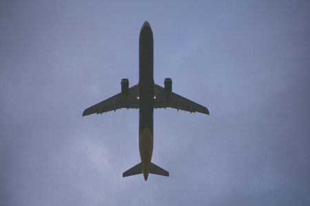Plane is flying. Standard turistic plane on sky background.の写真素材