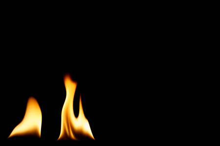 Single naked flame in black space.の写真素材