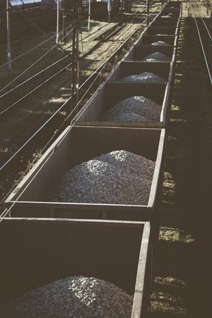 Cargo train with aggregate stones. Above view.の写真素材
