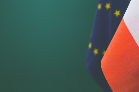 Flags of Poland and United Europe with green background empty space for your text on left.の写真素材