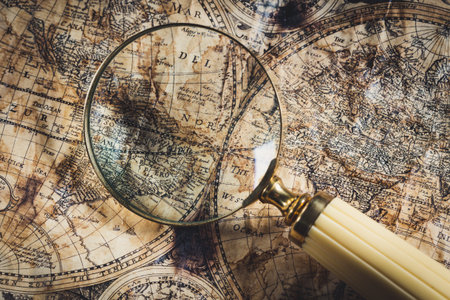 View through magnifier on old map, showing America word.