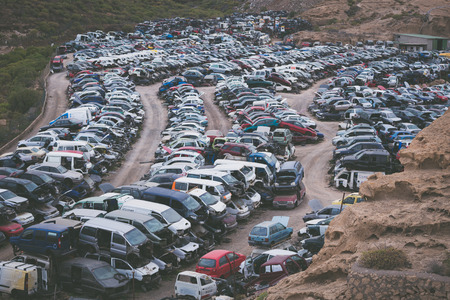 Car junkyard with many forgotten wrecks passenger cars.のeditorial素材
