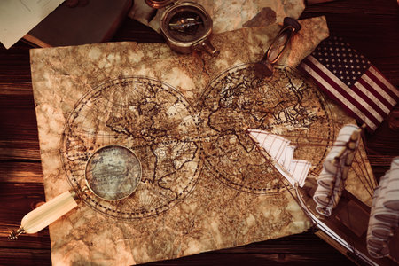 Old vintage maps and marine equipment like compass, magnifier or hourglass and ship. Columbus Day...