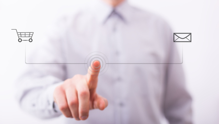 Male finger are pressing an imaginary button on bokeh, web shopping concept.の写真素材