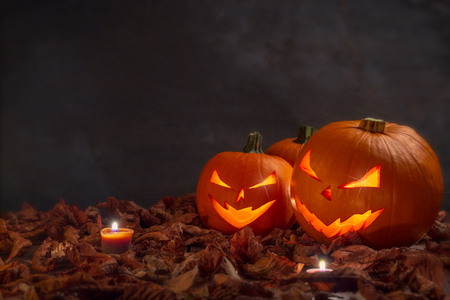 Carving halloween pumpkins on wooden plank background.の写真素材