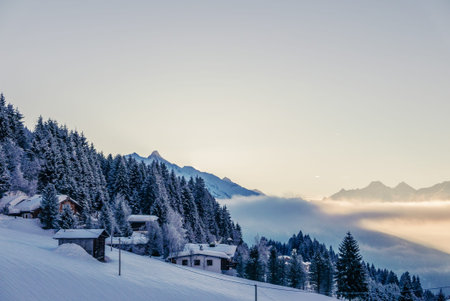 Small hut in Alps mountains in winter scenery.のeditorial素材