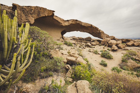 Arco de Tajao is natural sandstone arch in Tenerife, Canary Islands.の写真素材
