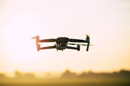 Drone flying during sunset.の写真素材