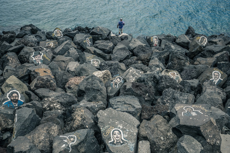 TENERIFE, SPAIN â May 30, 2018: Rocks with painting portraits of famous musicians near Auditorio de Tenerife.のeditorial素材