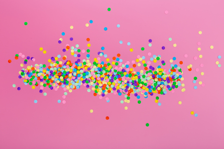 Colorful confetti on pinkの写真素材