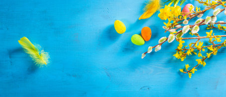 Easter flat lay with spring flower, willow and easter eggs.