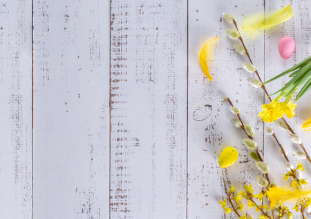 Easter flat lay with spring flower, willow and easter eggs.の写真素材