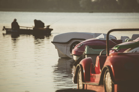 Pedal boats on marina.
