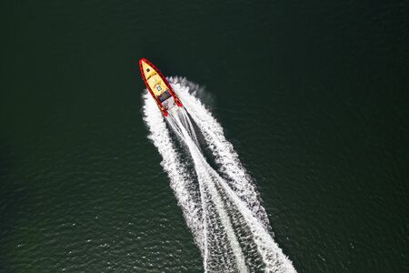 Top down view on speed movement of rescue motorboat.の写真素材
