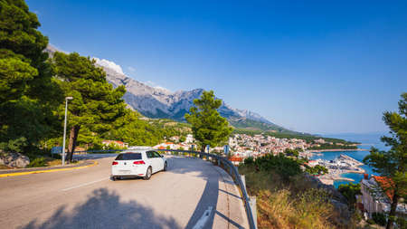 Baska Voda, Croatia,  24 August, 2019: Car on road to Riviera Makarska, people in travel to Baska Voda. Croatia.のeditorial素材