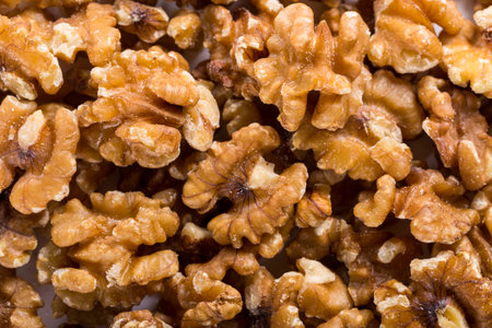 Background of big raw peeled walnuts situated arbitrarily.の写真素材