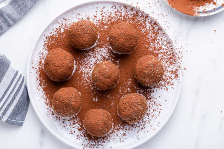 Healthy homemade power balls dessert made with oatmeal, dates, peanut butter, and other bacalias.の写真素材