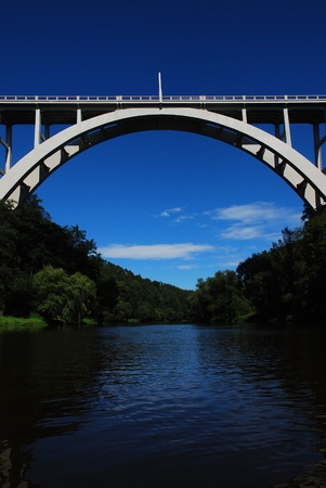 arched bridge over the river	の写真素材