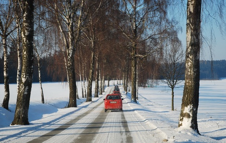number of cars on winter road with snowの写真素材
