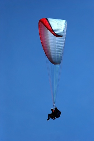 tandem paragliding in the blue sky, flying in the skyの写真素材